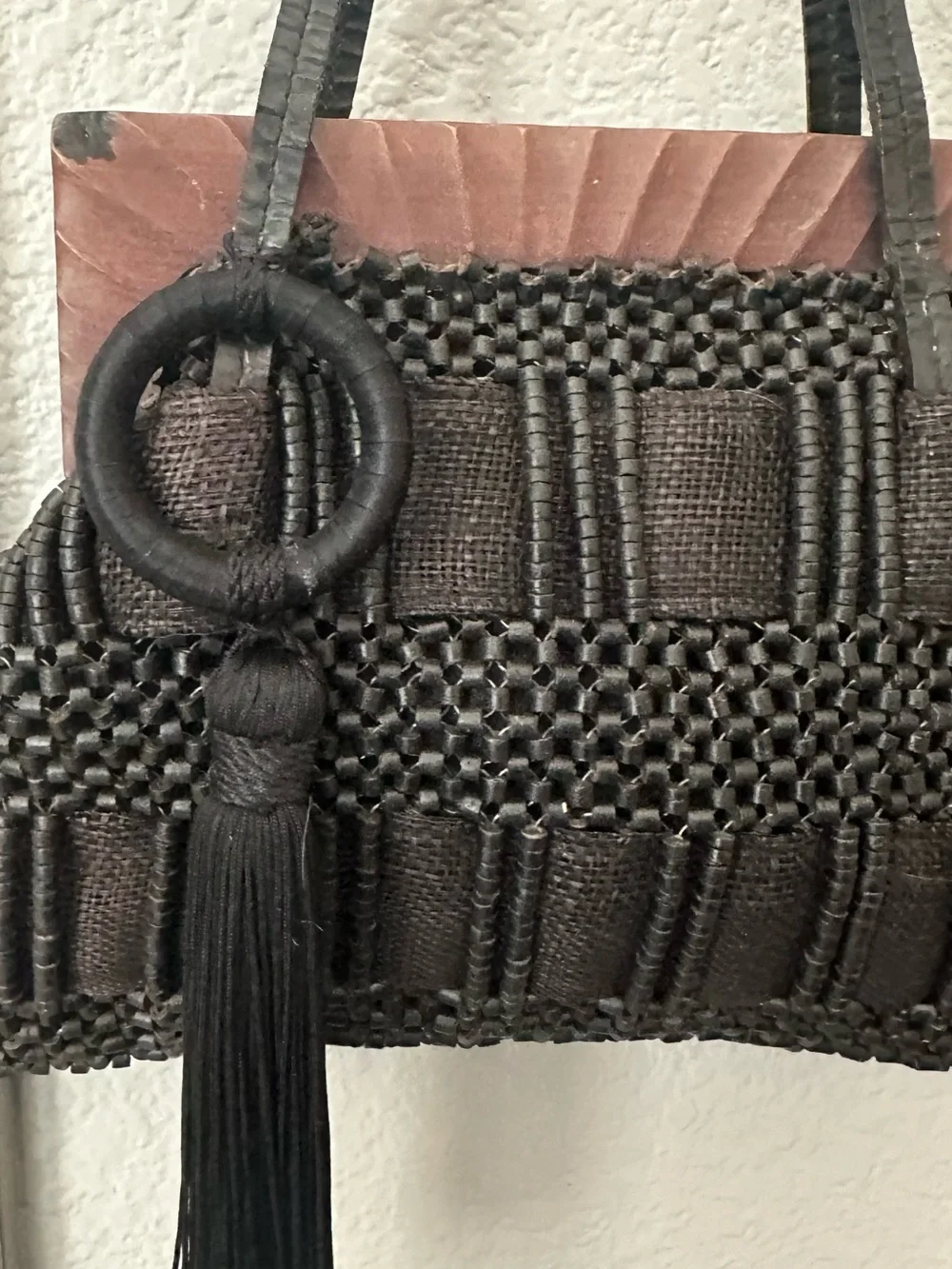 Aranaz Antik Batik tote features a wooden frame woven beaded detail and tassel